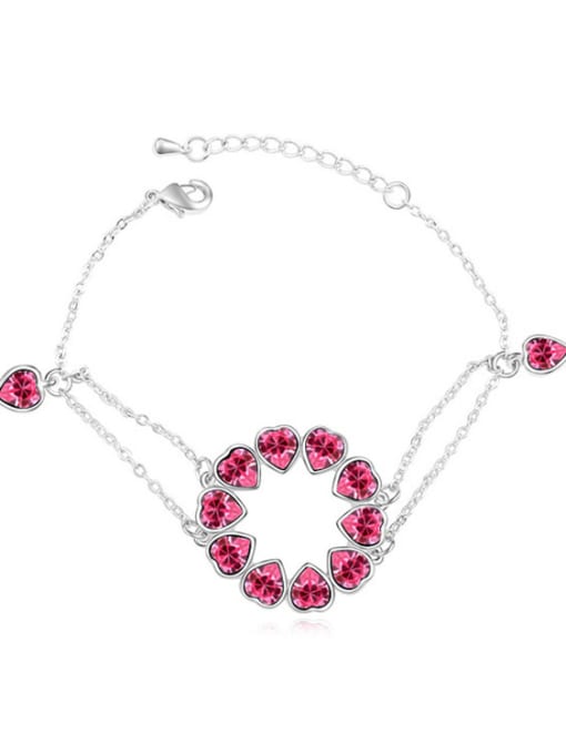pink Chanz using austrian Elements Crystal Bracelet nestled in the heart to heart bracelet