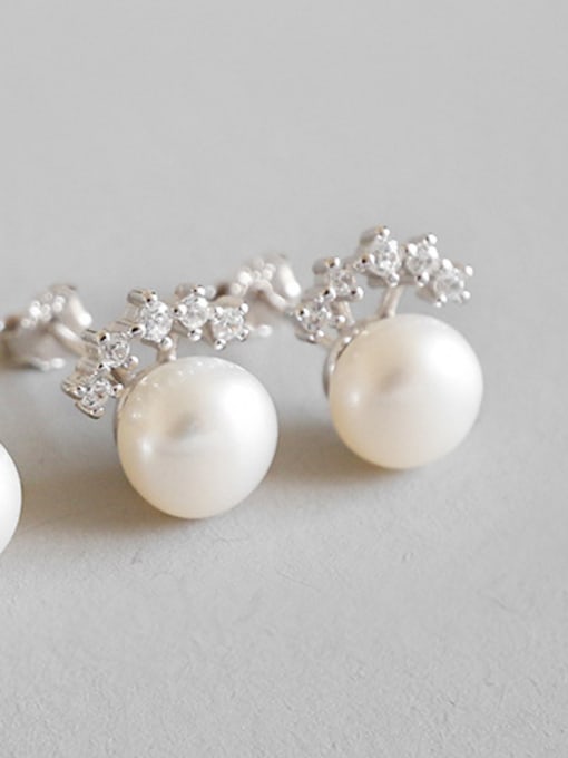 Platinum Sterling silver micro-encrusted freshwater pearl crown stud earrings