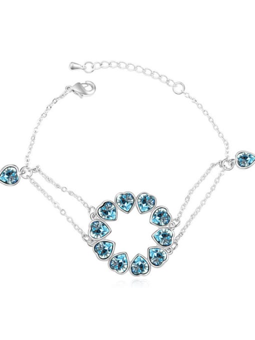 light blue Chanz using austrian Elements Crystal Bracelet nestled in the heart to heart bracelet