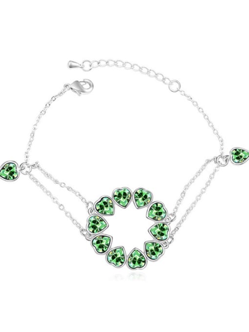 green Chanz using austrian Elements Crystal Bracelet nestled in the heart to heart bracelet