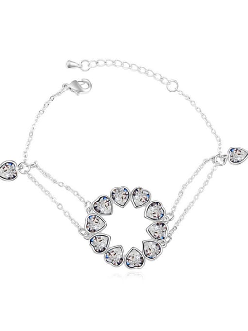 White Chanz using austrian Elements Crystal Bracelet nestled in the heart to heart bracelet