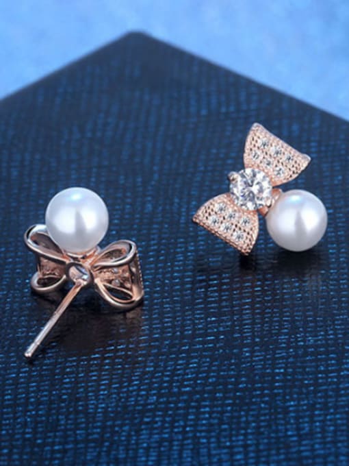 AI Fei Er Elegant Shiny Zirconias Bowknot Imitation Pearl Stud Earrings 1
