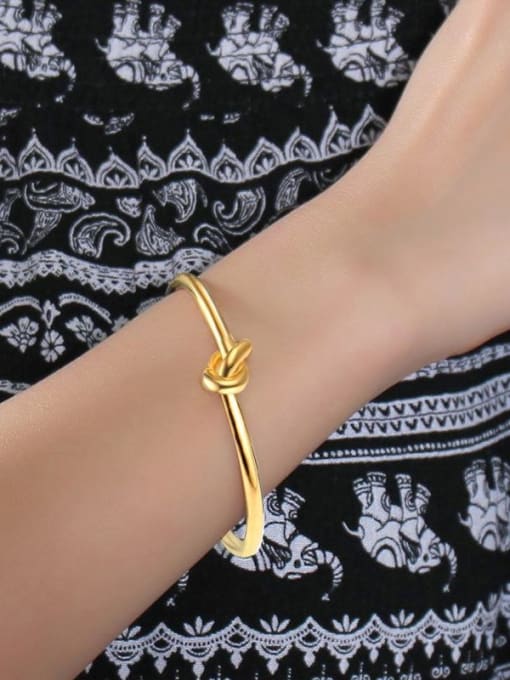 CONG Open Design Gold Plated Knot Shaped Titanium Bangle 1