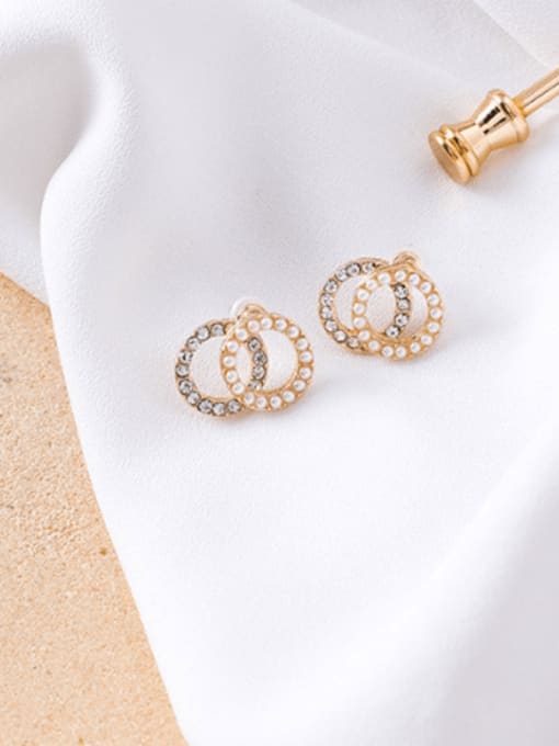 A white diamond (ring type) Alloy With Imitation Gold Plated Simplistic Hollow Geometric Stud Earrings