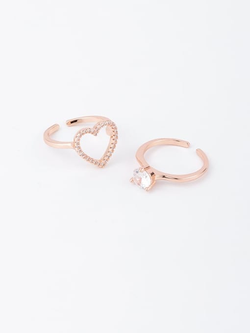 A gold Brass Rhinestone White Heart Minimalist Stackable Free Size Ring