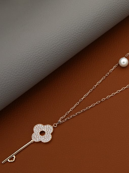 Lin Liang Brass Rhinestone White Key Minimalist Long Strand Necklace 1