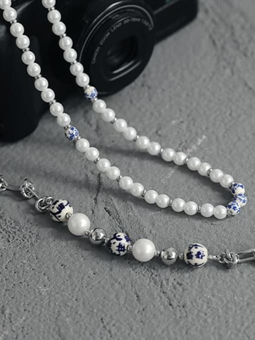 TINGS Brass Porcelain Geometric Ethnic Beaded Knot Necklace 3