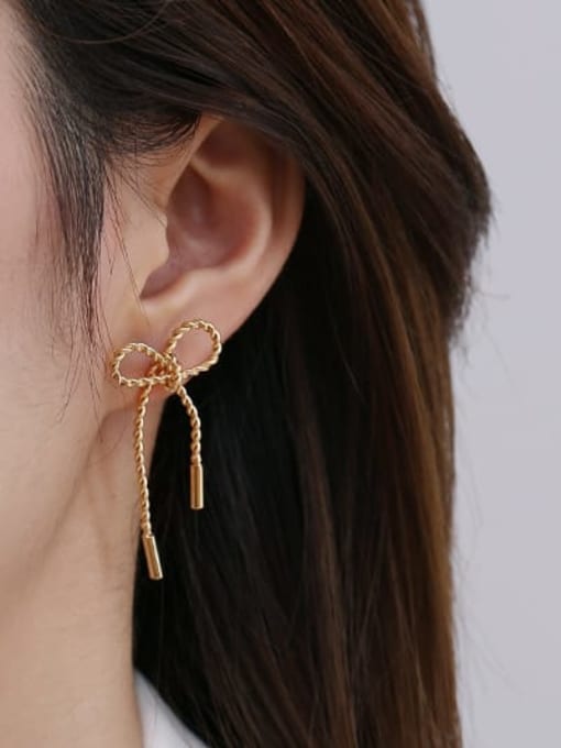 ACCA Brass Hollow Bowknot Ethnic Stud Earring 1