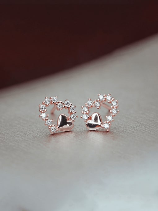 A pair of rose gold 925 Sterling Silver Cubic Zirconia Heart Minimalist Stud Earring